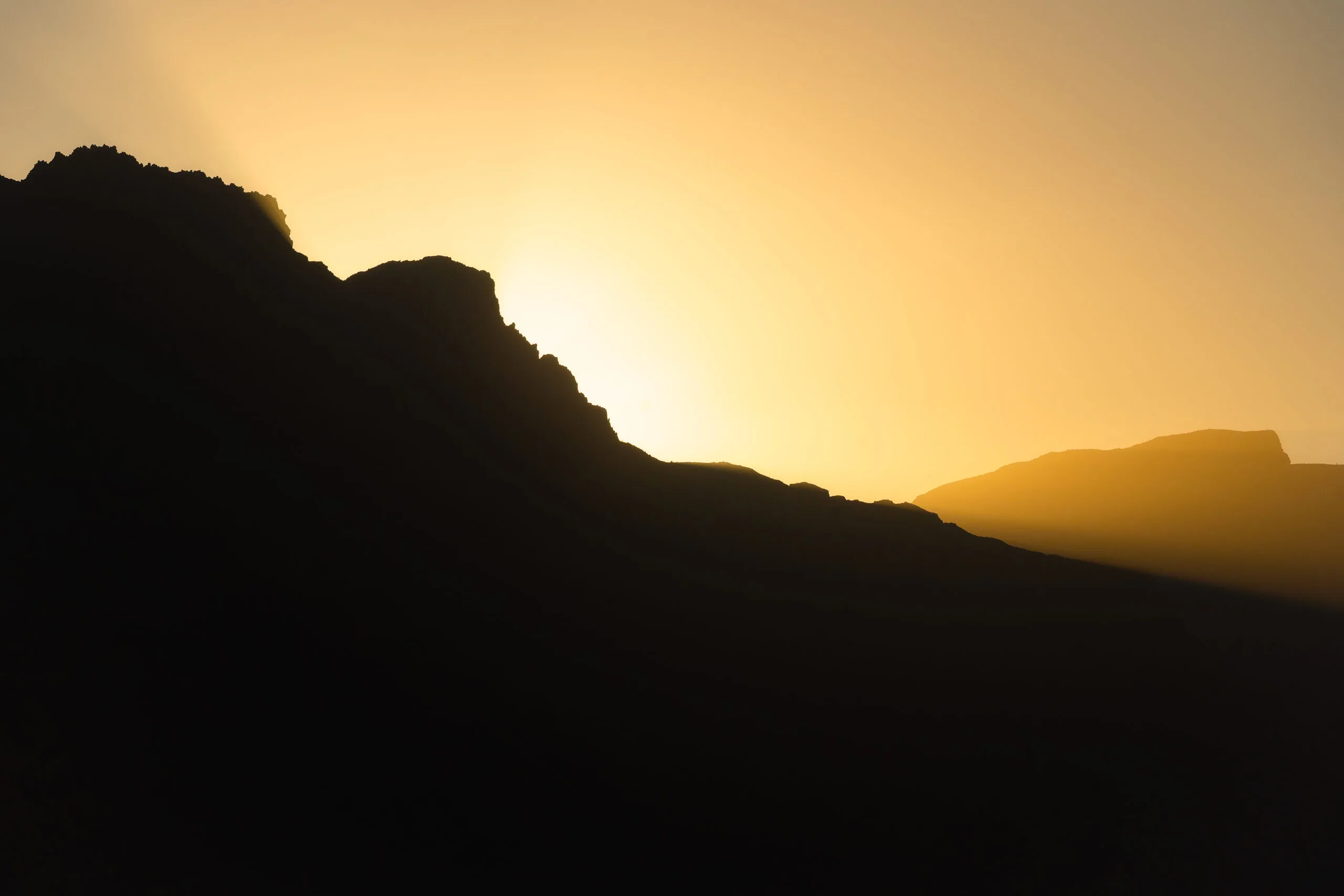 Mountain silhouette against golden sunset sky, Gran Canaria
