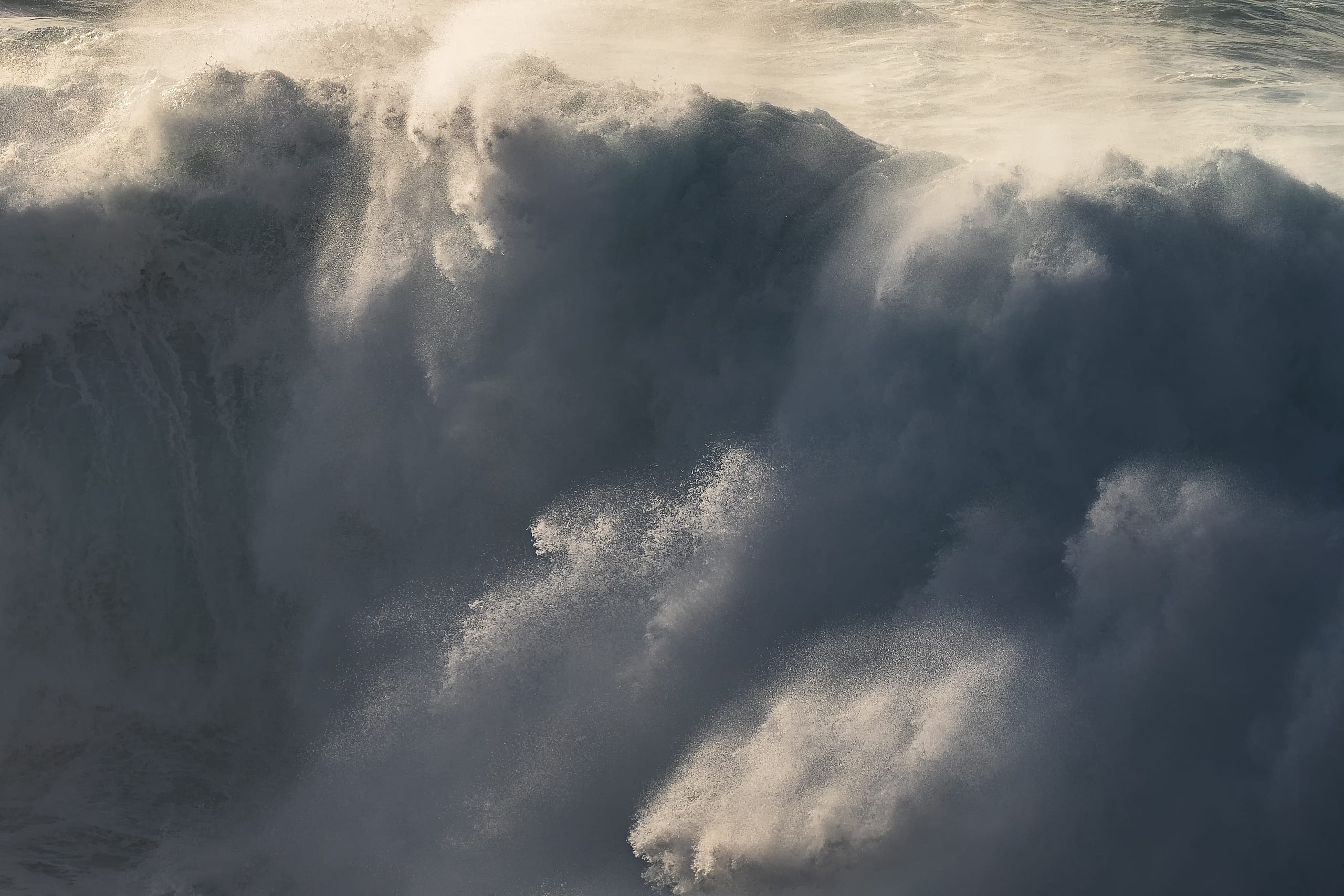 Soft slow motion ocean wave in pale blue tones, long exposure Gran Canaria
