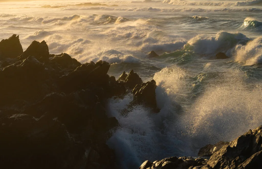 Foamy Atlantic waves washing over black volcanic rocks, Gran Canaria