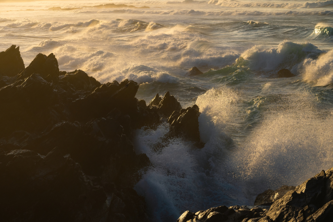 Foamy Atlantic waves washing over black volcanic rocks, Gran Canaria