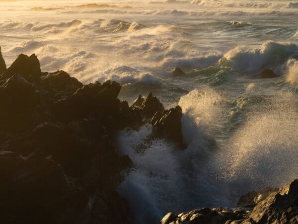 Foamy Atlantic waves washing over black volcanic rocks, Gran Canaria