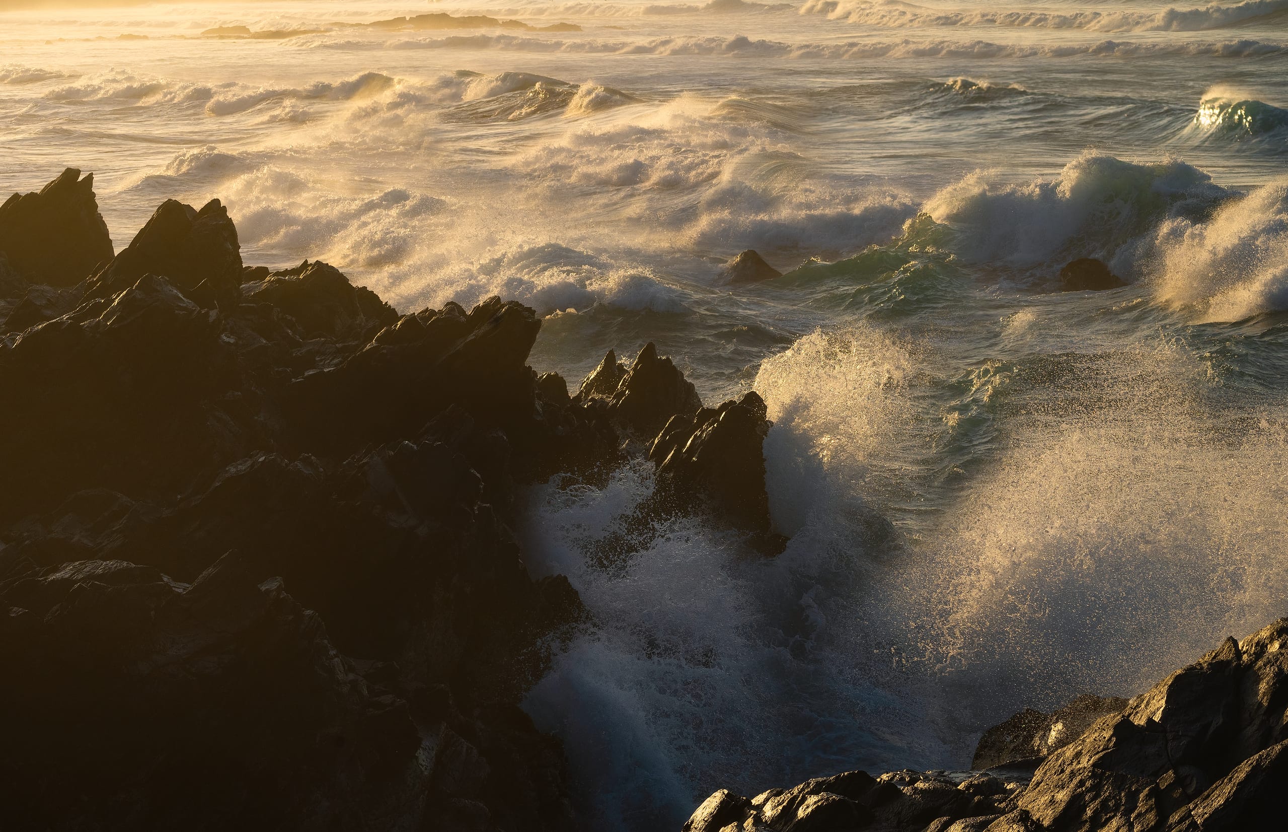 Foamy Atlantic waves washing over black volcanic rocks, Gran Canaria