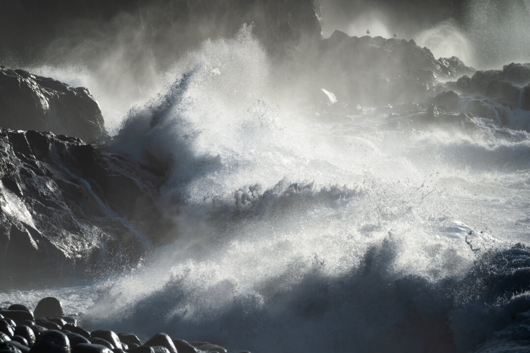 Powerful ocean waves breaking over volcanic rocks, Gran Canaria