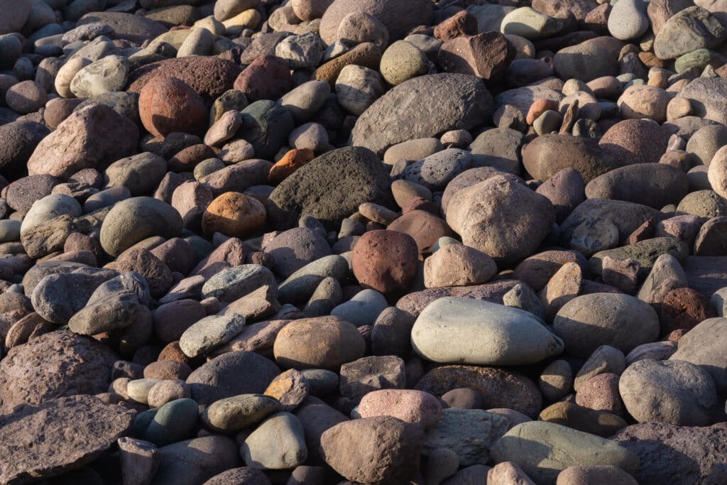 Colorful smooth volcanic pebbles on Gran Canaria beach
