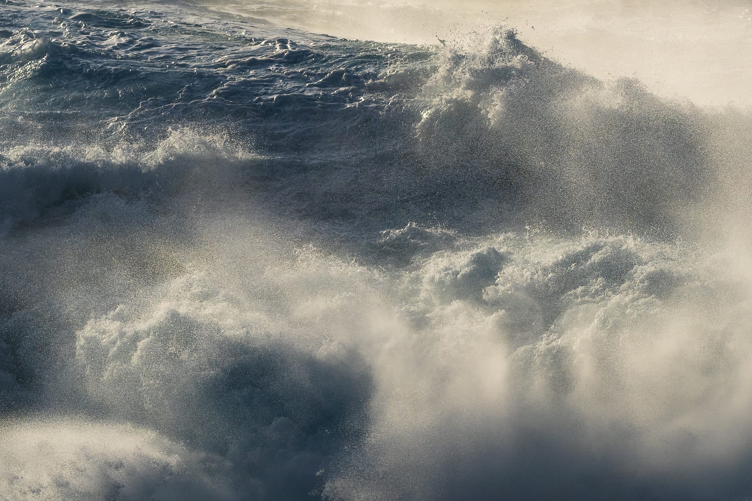 Close-up texture of breaking ocean wave with mist spray, Gran Canaria